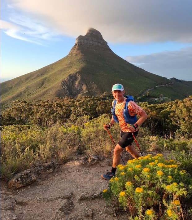 Freddie trail running with Lion's Head in the background