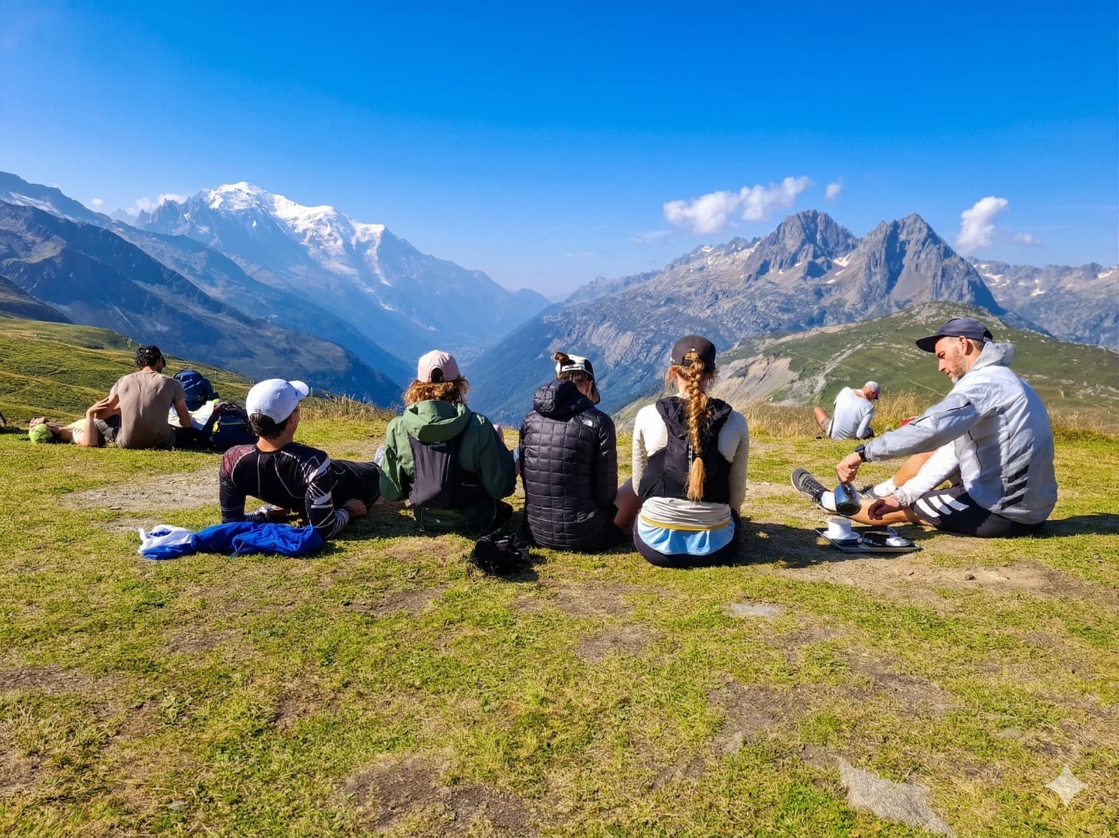 Athletes resting with mountain views